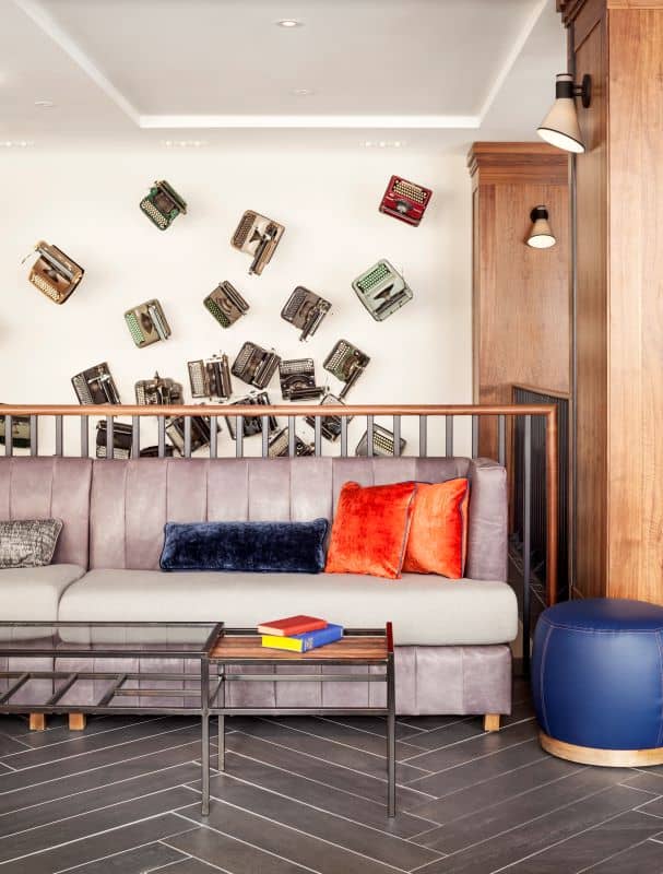 Sofa seating with antique typewriters on the wall