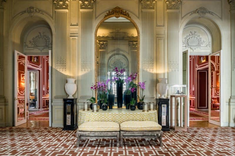 Elegant lobby area with three large archways and floral arrangements